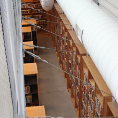 View of the downstairs book collection from the bridge